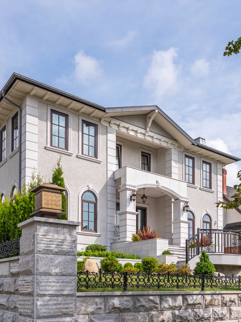 Home combining stone veneer with a stucco exterior